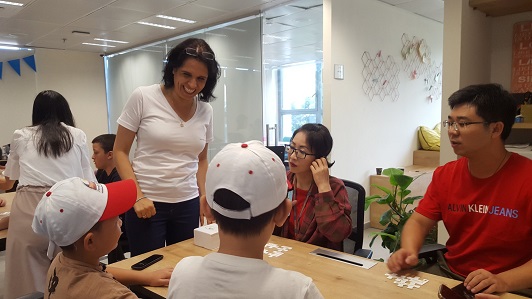 Galit Zamler leads a workshop for a group of parents and children from China